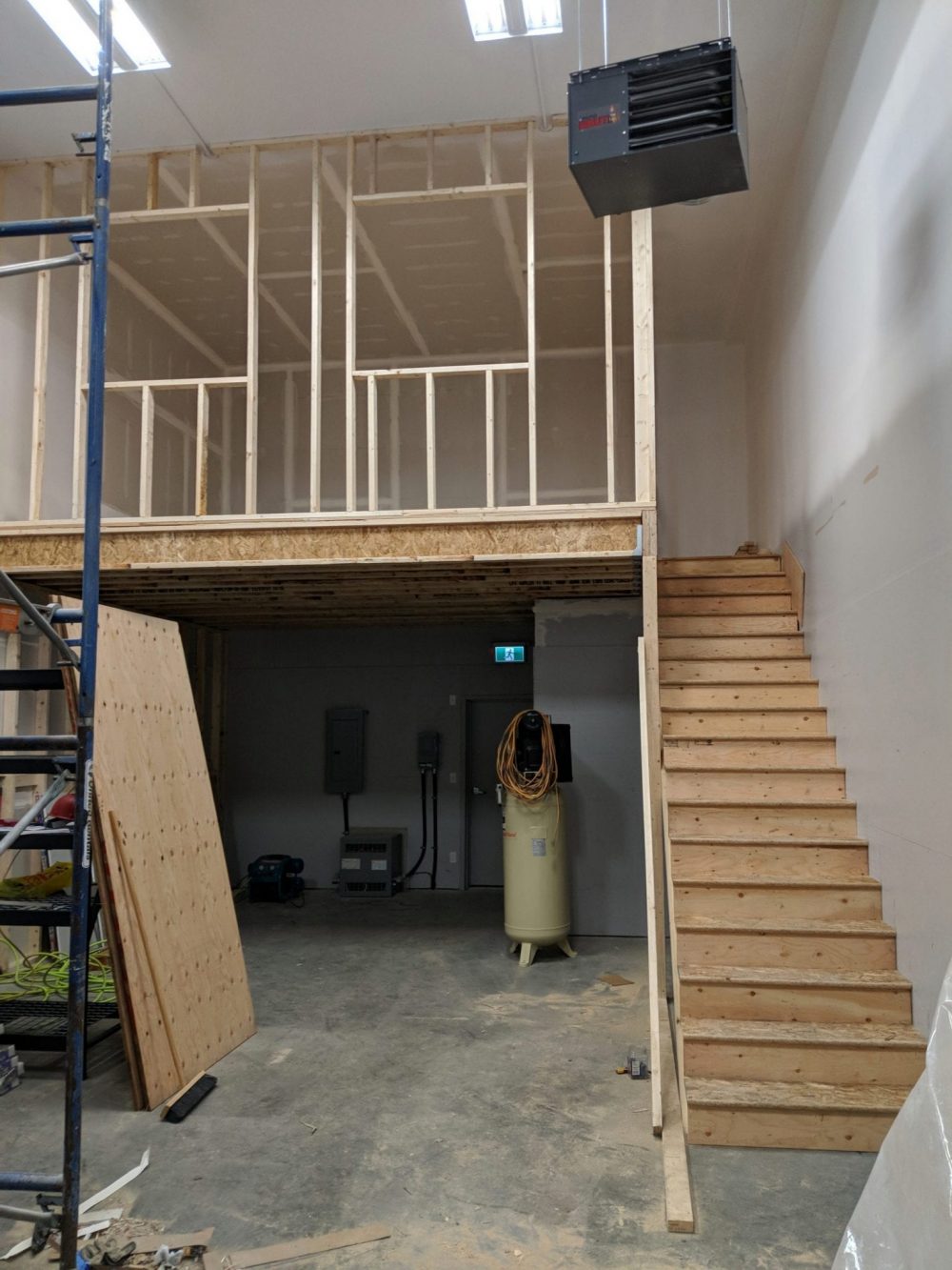 Tenant improvements at commercial bay, mezzanine framing and stairs